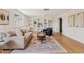Bright living room with hardwood floors and built-in shelves at 5738 N 34Th S Dr, Phoenix, AZ 85017