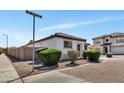 Street view of a single-story home featuring manicured landscaping and a red brick street at 6108 S Wilson Dr, Chandler, AZ 85249