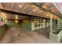 Covered front porch with ambient lighting, offering an inviting outdoor living space at 7813 N 17Th Dr, Phoenix, AZ 85021