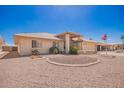 Inviting front yard with desert landscaping and charming curb appeal on a sunny day at 8037 E Navarro Ave, Mesa, AZ 85209