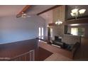 Open concept living room showcases brick fireplace, hardwood floors, and natural light at 8310 N 49Th Ave, Glendale, AZ 85302