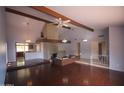 Spacious living room features a vaulted ceiling with hardwood floors and modern lighting at 8310 N 49Th Ave, Glendale, AZ 85302