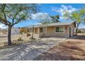 Quaint single-level home with desert landscaping and a shaded front entrance at 9522 E Quarterline Rd, Mesa, AZ 85207