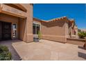 View of private entrance featuring a decorative security door and large flagstone patio at 9642 E Irwin Ave, Mesa, AZ 85209