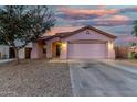 Charming single-story home with a two-car garage and low maintenance gravel landscaping at 9704 W Cordes Rd, Tolleson, AZ 85353