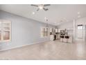 Open floor plan featuring tile floors, plantation shutters, and access to the kitchen at 1712 E Saratoga St, Gilbert, AZ 85296