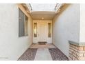 Inviting front entry with neutral colors, covered entrance, and stone accents at 1779 E Kaibab Dr, Chandler, AZ 85249