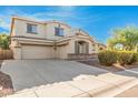 Three car garage home featuring a long driveway and manicured bushes at 1779 E Kaibab Dr, Chandler, AZ 85249