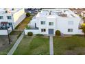 An aerial view showcases the townhome's layout with a well-maintained lawn and private fenced-in area at 5243 N 42Nd Ln, Phoenix, AZ 85019