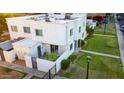 Aerial view showing the unit's private patio, well-maintained lawn, and proximity to community parking at 5243 N 42Nd Ln, Phoenix, AZ 85019