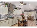 Bright kitchen featuring white cabinets, a center island, granite countertops, and stainless steel appliances at 7256 E Desert Vista Rd, Scottsdale, AZ 85255