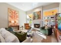 Bright and inviting living room with a fireplace and large windows offering plenty of natural light at 9915 E Cinnabar Ave, Scottsdale, AZ 85258