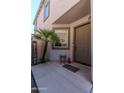 Inviting front porch featuring neutral color scheme, welcome sign, and a cozy seating area at 13434 W Rovey Ave, Litchfield Park, AZ 85340