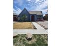 Quaint home with arid landscaping, concrete walkway, and red outdoor furniture at 1629 E Garfield St, Phoenix, AZ 85006