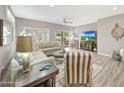 Spacious living room with ample seating, natural light, and modern décor at 16427 W Labyrinth Ln, Surprise, AZ 85374