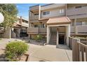 Exterior view of a well-maintained residence with charming architectural details and easy access to exterior entry at 1645 W Baseline Rd # 2125, Mesa, AZ 85202