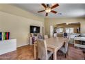 Inviting dining room with tile flooring, modern light fixture, and adjacent living spaces at 16820 N 152Nd Ln, Surprise, AZ 85374