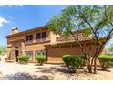 Charming two-story home featuring stone accents, a tiled roof, and well-maintained landscaping at 19700 N 76Th St # 1151, Scottsdale, AZ 85255