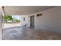Spacious carport adjacent to the home's entrance, offering sheltered parking and protection from the elements at 2325 E Delgado St, Phoenix, AZ 85022