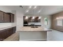 Modern kitchen featuring granite countertops, stainless steel appliances, and a spacious center island at 23497 S 212Th St, Queen Creek, AZ 85142
