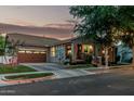 Charming home exterior with a well-manicured lawn, welcoming entrance and attached garage, creating curb appeal at 2721 E Tamarisk St, Gilbert, AZ 85296