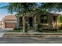 Charming home exterior with a well-manicured lawn, welcoming entrance and attached garage, creating curb appeal at 2721 E Tamarisk St, Gilbert, AZ 85296