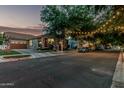 Neighborhood street view featuring houses with mature trees and parked cars along the curb, highlighting community charm at 2721 E Tamarisk St, Gilbert, AZ 85296