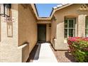 Welcoming front entrance with a charming door and picturesque landscaping at 4024 E Maplewood St, Gilbert, AZ 85297
