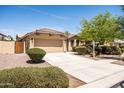 Inviting curb appeal with a lovely front yard and a convenient two-car garage at 4024 E Maplewood St, Gilbert, AZ 85297