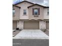 Townhome featuring attached garages and classic design elements at 4073 E Amoroso Dr, Gilbert, AZ 85296