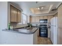 Efficient kitchen with black appliances, ample cabinet space, and tile flooring at 4925 E Desert Cove Ave # 326, Scottsdale, AZ 85254
