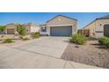 Attractive single-story home with desert landscaping, concrete driveway and an attached two-car garage at 5079 E Emery Rd, San Tan Valley, AZ 85143