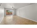 Bright bedroom featuring tiled floors and a sliding door to an outdoor patio at 540 N May N St # 3053, Mesa, AZ 85201