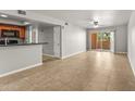 Open-concept living area with tiled flooring and access to a private balcony at 540 N May N St # 3053, Mesa, AZ 85201