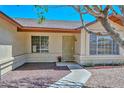 Inviting home entrance featuring a security door and well-maintained landscaping at 6623 N 85Th Ave, Glendale, AZ 85305