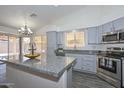 Modern kitchen featuring granite countertops, stainless steel appliances, and island at 6623 N 85Th Ave, Glendale, AZ 85305