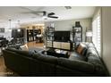 Open-concept living room featuring hardwood floors and a cozy sectional sofa at 1217 N 78Th St, Scottsdale, AZ 85257