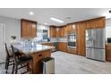 Spacious kitchen with custom cabinets, stainless steel appliances, granite countertops, and tile flooring at 12841 W W . Via Camille --, El Mirage, AZ 85335