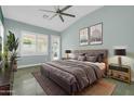 Beautiful main bedroom featuring large windows and patio door to the pool area at 1487 E Laredo St, Chandler, AZ 85225