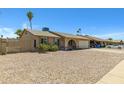 Charming single-story home with low maintenance gravel front yard and an attached two car garage at 2305 E Glade Ave, Mesa, AZ 85204