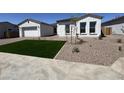 Charming single-story home featuring a nicely maintained front yard in a well-maintained neighborhood at 26232 N 77Th Dr, Peoria, AZ 85383