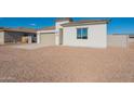 Charming single-story home with a beige color scheme and a well-maintained desert landscape at 34865 N Palm Dr, San Tan Valley, AZ 85140