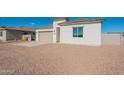 Charming single-story home with a beige color scheme and a well-maintained desert landscape at 34865 N Palm Dr, San Tan Valley, AZ 85140