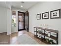 Welcoming foyer with tiled floors, an open entry, and charming decor at 3671 E Kingbird Pl, Chandler, AZ 85286