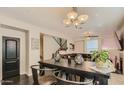 Dining area features a modern table, chairs, and decorative lighting, connecting to the living space at 5550 N 16Th St # 113, Phoenix, AZ 85016