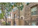 Attractive townhome boasts stone accents, a welcoming entrance, and well-maintained landscaping at 5550 N 16Th St # 113, Phoenix, AZ 85016