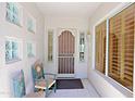 Cozy entryway with tile floors, decorative chairs and plenty of natural light at 6714 E Amber Sun Dr, Scottsdale, AZ 85266