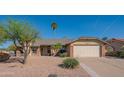 Charming single-story home with brick accents, well-maintained landscaping, and a two-car garage at 11447 N 109Th St, Scottsdale, AZ 85259