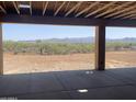 Covered patio showcasing serene desert views and distant mountains on a bright sunny day at 1244 E Smokehouse Trl, Phoenix, AZ 85085