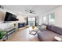 Cozy living room with a fireplace, lake view, and comfortable sectional sofa at 3002 N 70Th St # 120, Scottsdale, AZ 85251